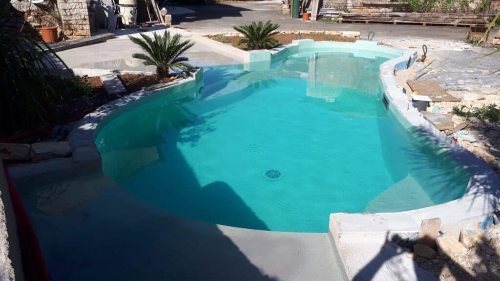 Freshly resurfaced swimming pool with durable finish.