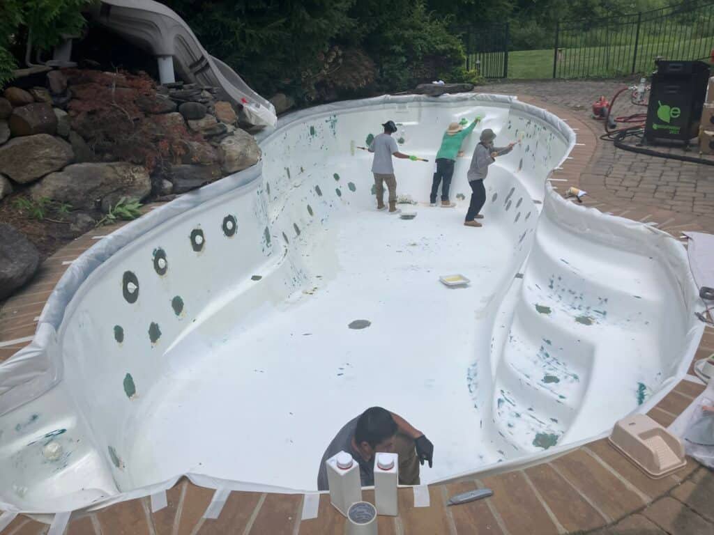 Old plaster removal during pool renovation process