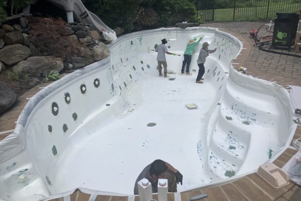 Old plaster removal during pool renovation process