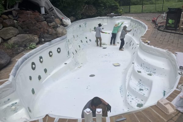 Old plaster removal during pool renovation process